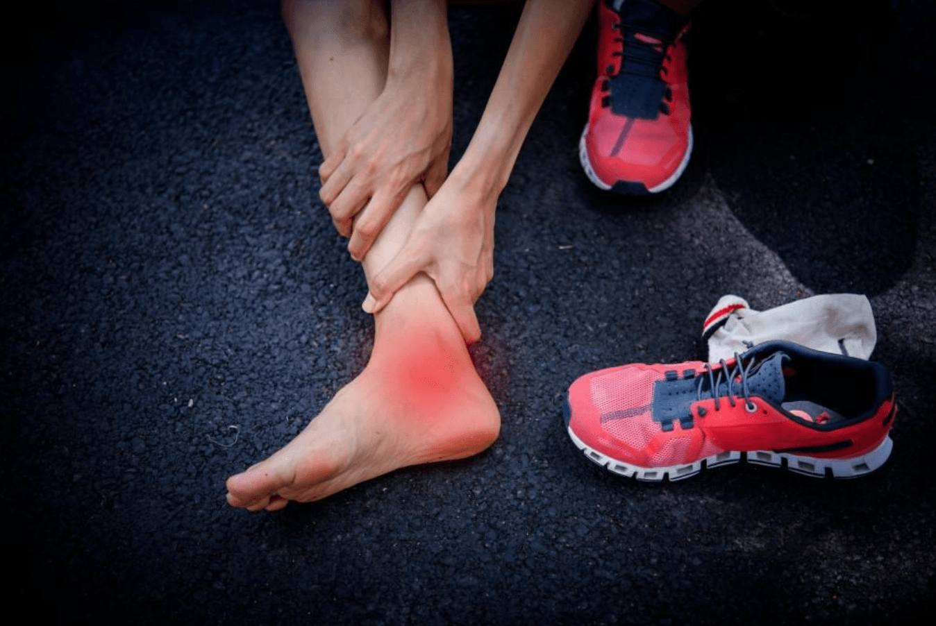 Ankle sprain treatment with red inflammation highlighted on ankle of runner. Understanding prevention and recovery strategies for common athletic injuries.