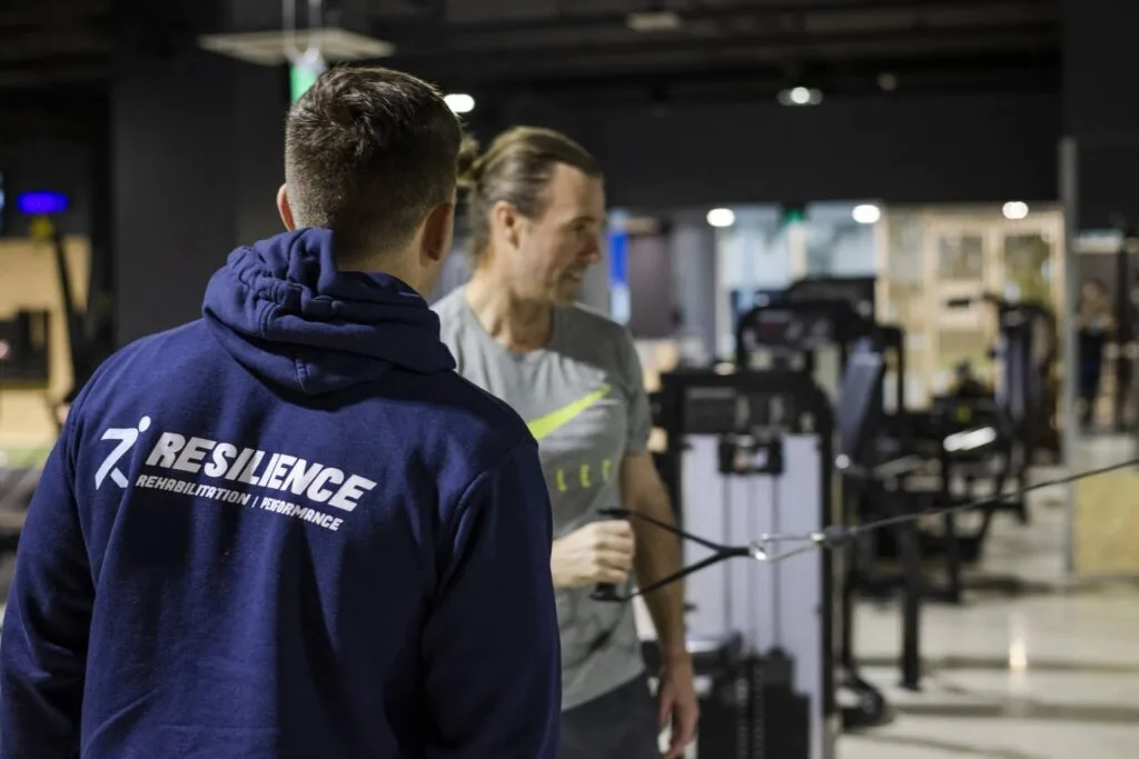Home | Resilience Rehab & Performance 1 Training session in a gym setting.